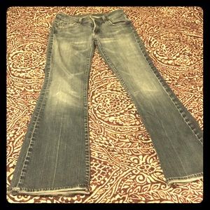 7 for All Mankind light wash bootcut jeans.
